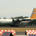 Pengiriman material huntara TNI AU ke Aceh menggunakan pesawat Hercules C-130